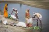 Farmers till the sands of the Kamala river in Nepal